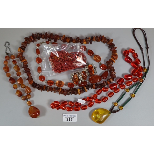 315 - Coral necklace with amber coloured pendant together with another amber necklace and collection of am... 