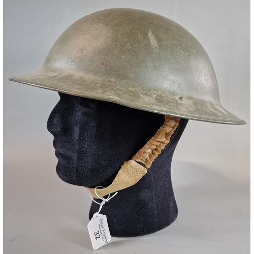 32 - British Military steel helmet with painted finish and original liner. Post WWII.  (B.P. 21% + VAT)