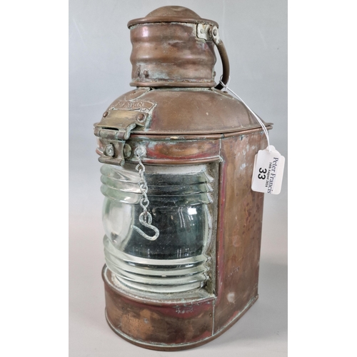 33 - Brass ship's navigation lamp with clear glass lens. 29cm high approx.  (B.P. 21% + VAT)