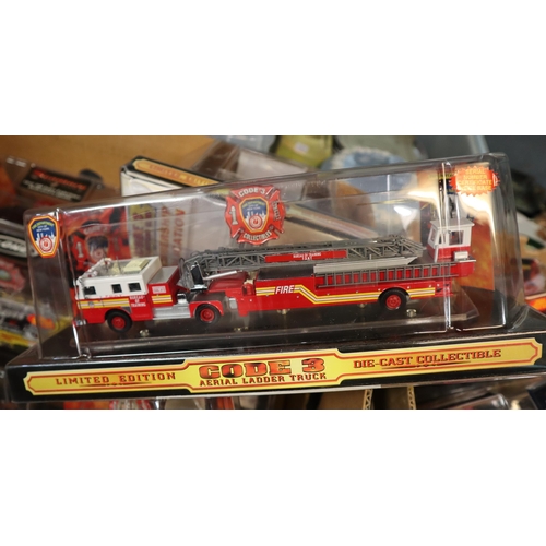 349 - Two boxes of Code 3 diecast limited edition fire engines and similar vehicles in original packaging.... 