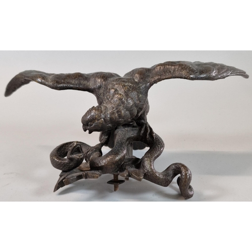 35 - Patinated bronze study of an eagle with snake. 22cm wide approx. (Probably mount from a clock).  (B.... 