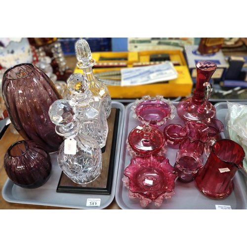 387 - Two trays of glass to include: cranberry glass jugs, bowls etc., amethyst glass vases, decanters and... 