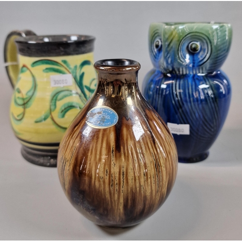 4 - Three items of Denby stoneware to include: owl jug, stylised foliate jug and a baluster vase, the ow... 