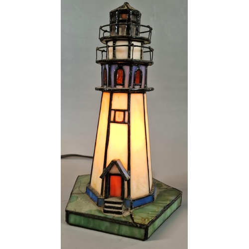 44 - Modern table lamp in the form of a lighthouse. 26cm high approx.  (B.P. 21% + VAT)