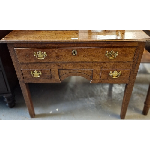 452 - 19th century oak lowboy, the moulded top above an arrangement on one long and two small drawers, sta... 