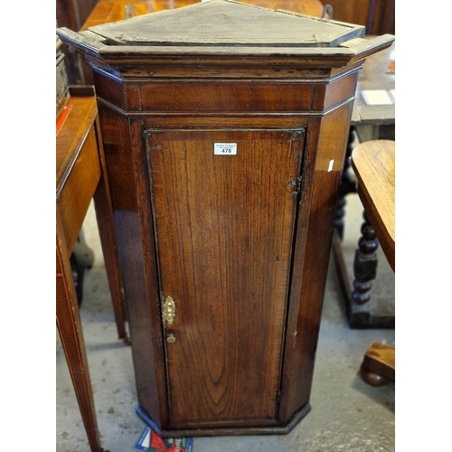 478 - 19th century oak narrow blind panelled hanging corner cupboard with fixed shelves to the interior. (... 