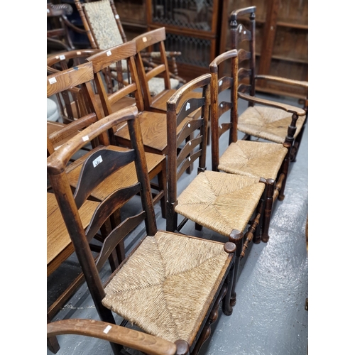 485 - Collection of five similar elm Lancashire style ladderback chairs, to include two armchairs, all wit... 