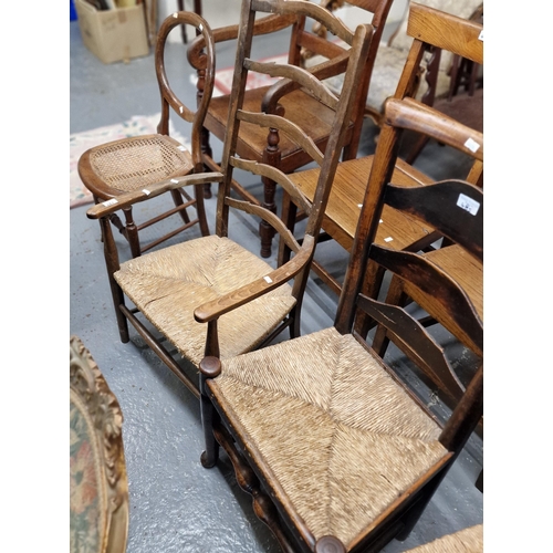 485 - Collection of five similar elm Lancashire style ladderback chairs, to include two armchairs, all wit... 