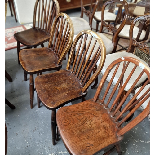 494 - Set of four late Victorian elm and beech spindle and curved back Windsor kitchen chairs, one marked ... 