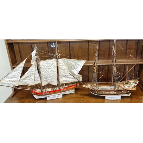 517 - Two modern model ships to include: Elizabethan race built galleon and Pirate Tops Schooner. (2)  (B.... 