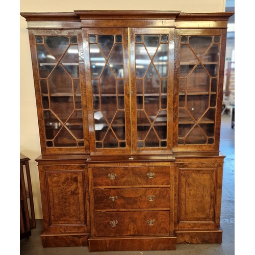 521 - Victorian style walnut break front bookcase, the moulded cornice above four astragal glazed doors wi... 