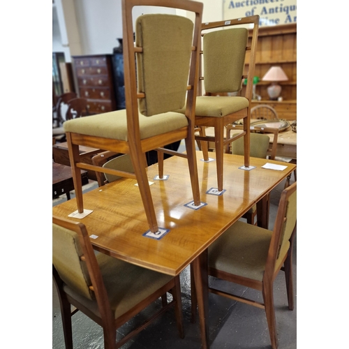 523 - Alfred Cox, a mid century teak dining room suite comprising sideboard, dining table and set of six c... 