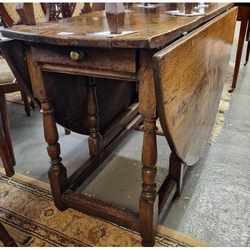 530 - 18th century oak gate leg table on turned supports and moulded stretchers. 14cm long approx.  (B.P. ... 