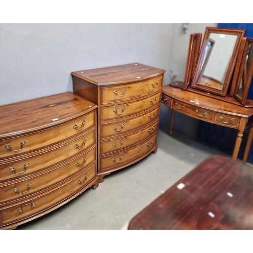 532 - Modern yew wood Four piece bedroom suite comprising four door wardrobe, bow front dressing table and... 