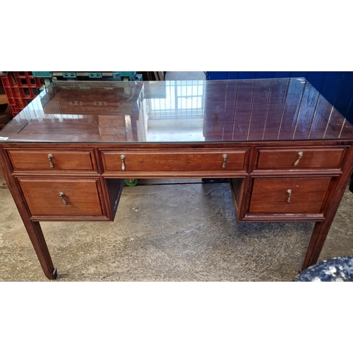 538 - Chinese hardwood writing desk with plate glass top over panel moulded upper surface, an arrangement ... 