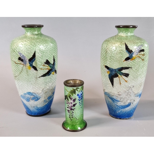 54 - Pair of Japanese Cloisonné  vases, overall decorated with birds above waves, one lacking its base an... 