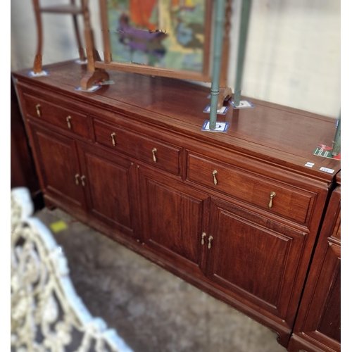 544 - A pair of 20th century Chinese hardwood sideboard bases each with three moulded frieze drawers over ... 