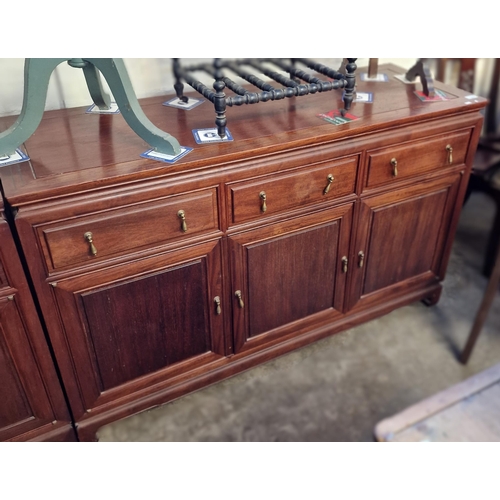 544 - A pair of 20th century Chinese hardwood sideboard bases each with three moulded frieze drawers over ... 