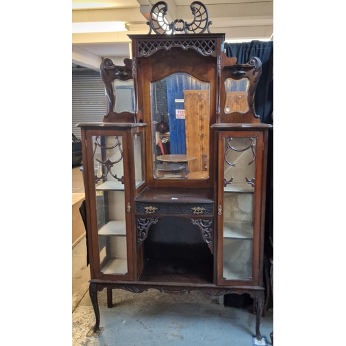 581 - Edwardian mahogany mirror back ornately carved display cabinet. (B.P. 21% + VAT)