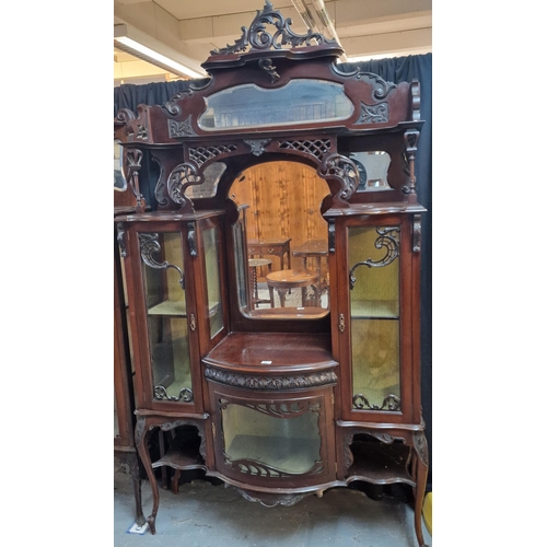 582 - Edwardian mahogany mirror back ornately carved display cabinet. (B.P. 21% + VAT)