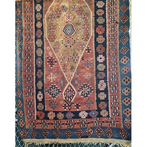 584 - Vintage Turkish Kilim rug on a red ground with central lozenge geometric panel flanked by repeating ... 