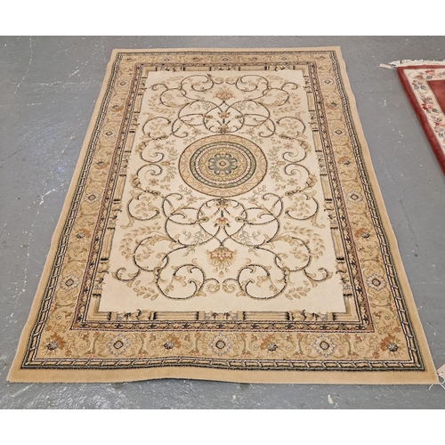 589 - Modern machine made cream/beige ground floral and foliate carpet with central circular medallion. 23... 