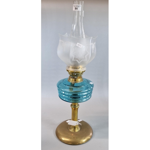 84 - Early 20th century double oil burner lamp having glass chimney, frosted and etched glass shade above... 