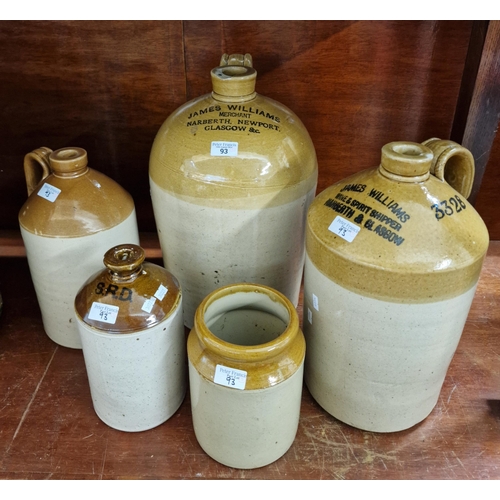 93 - Collection of stoneware flagons and other items to include: James Williams Merchant Narbeth, Newport... 