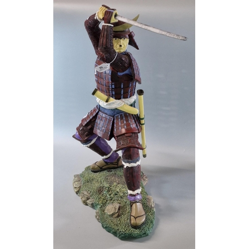 98 - Modern resin study of a Samurai Warrior with his sword on naturalistic base. 60cm high approx.  (B.P... 