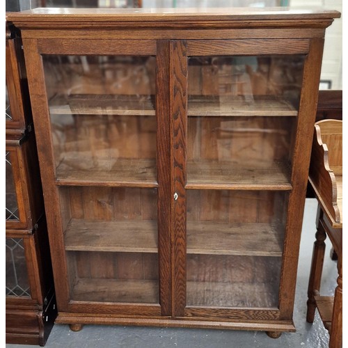 471 - Early 20th century Oak two door glazed bookcase with fixed shelves. 116x32x147cm approx. (B.P. 21% +... 