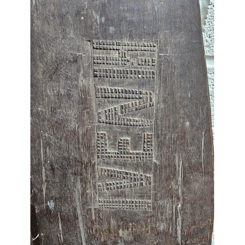 191 - Two South Seas design ceremonial paddles with chip carved decoration. 150cm long approx. (2)  (B.P. ... 