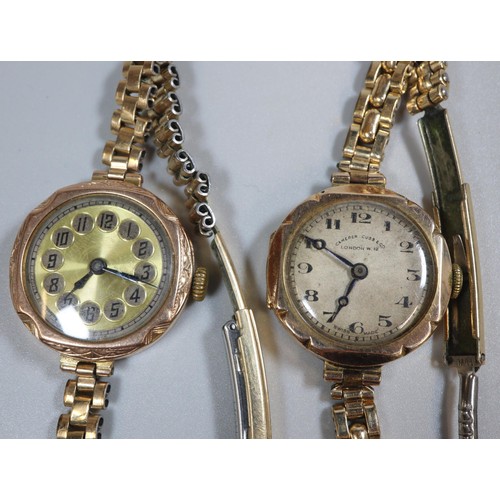 304 - Two ladies' gold open faced wrist watches in indented cases, both with expanding plated bracelet str... 