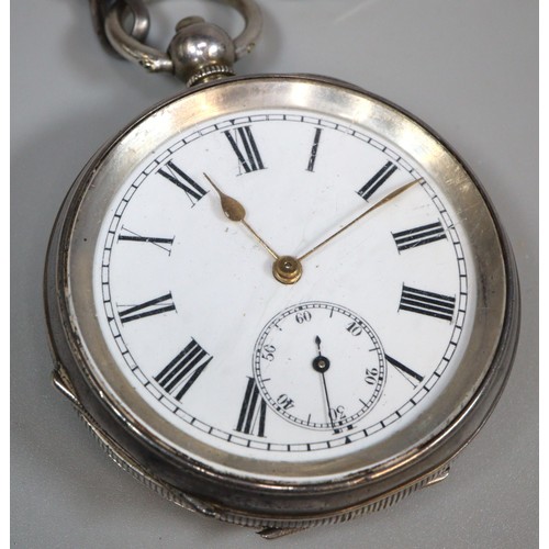 302 - Silver open faced key wind pocket watch with Roman numerals and seconds dial on a long silver curb l... 