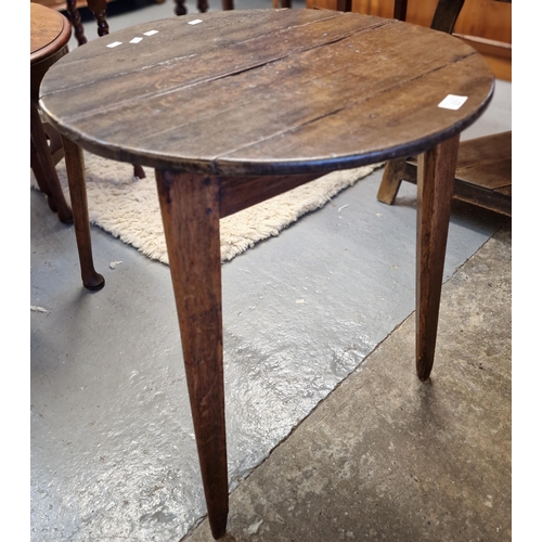 537 - Rustic oak plank top circular Cricket table on chamfered legs. 56cm diameter approx.  (B.P. 21% + VA... 