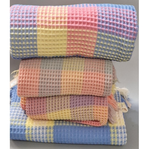 110 - Four similar multi-coloured honeycomb blankets (4) (B.P. 21% + VAT)