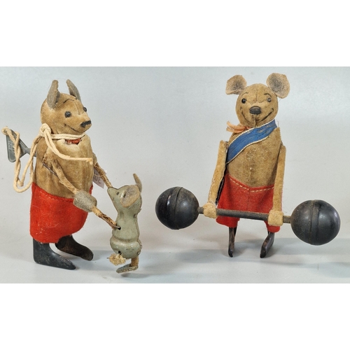 126 - Two vintage German Schuco clockwork tin plate figures, tumbling mouse and a mouse lifting weights, o... 