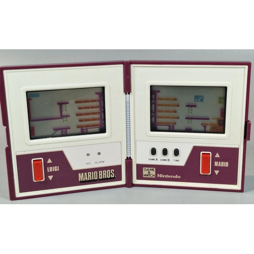 128 - Nintendo Game & Watch Mario Bros. (MW-56) handheld horizontal multiscreen electronic game. No box. U... 