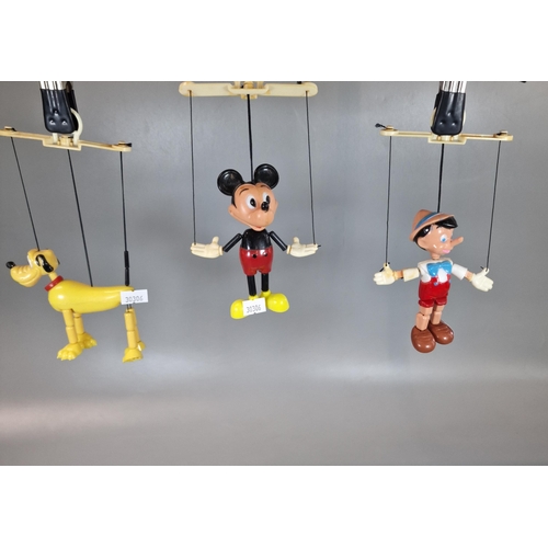 131 - Three Walt Disney Productions character puppets to include: Pinocchio, Mickey Mouse and Pluto. (3) (... 