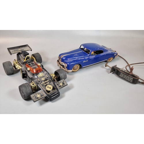 133 - Vintage German tinplate A W Arnold Primal 2800 remote control saloon car in blue, together with a Jo... 