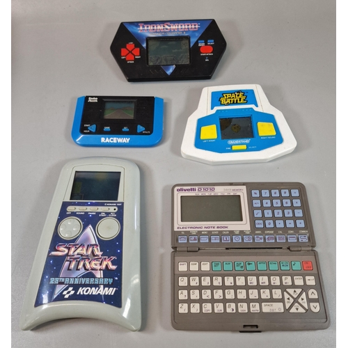 140 - Four Retro Electronic Handheld LCD games, to include: Iron Sword Wizards Warriors II (Acclaim, 1989)... 