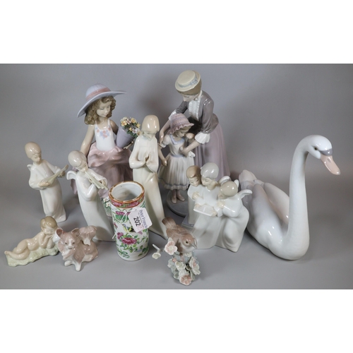 202 - Collection of Lladro Spanish porcelain and other similar items to include: swan, choir boy and girl,... 