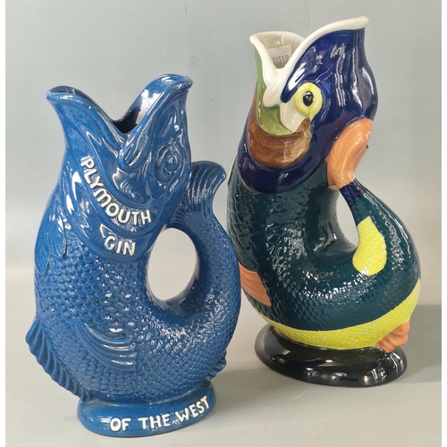 22 - Two Dartmouth Pottery Devon 'Glug Glug' jugs, one marked 'Plymouth Gin, the spirit of the West'. (2)... 