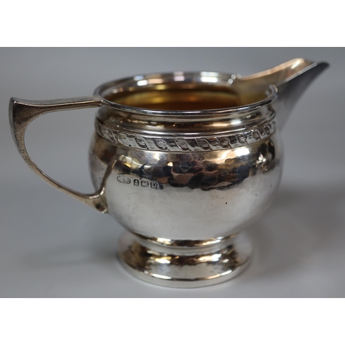 234 - George V silver four piece beaten finish tea service, by Albert Edward Jones of Birmingham, various ... 