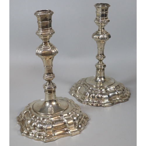 236 - Pair of George II style white metal (probably continental silver) knopped candlesticks with fluted a... 