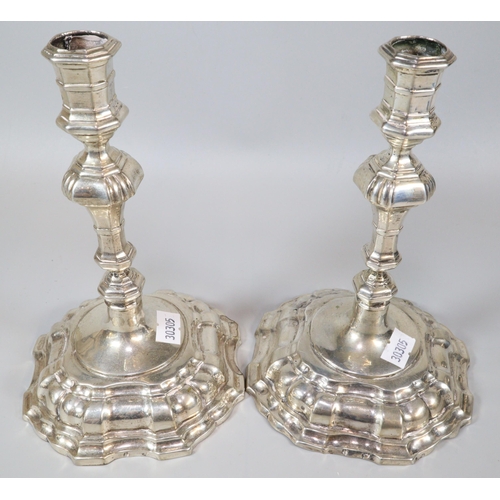 236 - Pair of George II style white metal (probably continental silver) knopped candlesticks with fluted a... 