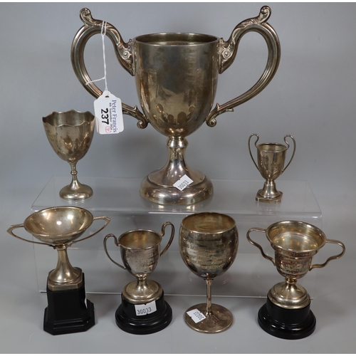 237 - Collection of mainly silver two handled trophy cups, three on plastic plinths together with a silver... 