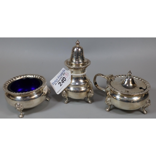 240 - Silver three piece condiment set comprising: pepperette, salt and mustard, with blue glass liners, B... 