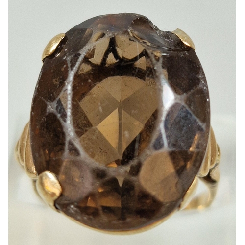 255 - Yellow metal and smokey quartz dress ring with heart pierced decoration. 6.7g approx. Size L.  (B.P.... 