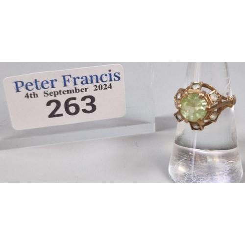 263 - 9ct gold multi cluster clear stone ring with central green stone. 3.5g approx. Size L.  (B.P. 21% + ... 