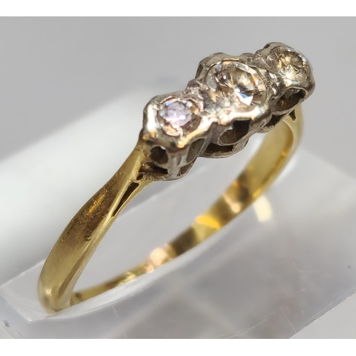 264 - 9ct gold and platinum diamond three stone ring. 2.7g approx. Size K1/2.  (B.P. 21% + VAT)